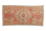 Distressed vintage Turkish Oushak rug runner, blush field with an ivory stepped medallion.