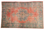 Distressed vintage Oushak carpet with brick red abrashed field and blue medallion, 6'2