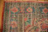 Vintage distressed Oushak rug corner: brick red, denim blue, mint green patterns, mostly even wear.