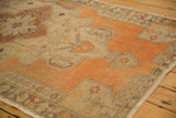 Distressed Oushak rug runner, tangerine orange field with geometric vinery and worn texture.