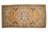 Distressed vintage Oushak rug with dusty gold, neutral, charcoal tones, diamond medallion, 3x5.5 ft.