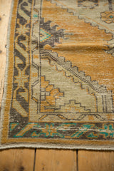 Vintage Distressed Oushak rug corner, showing even wear and turquoise geometric motifs.