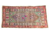Vintage Distressed Oushak runner with triple floral medallion, abrashed mauve-bronze field, pink border.