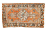 Distressed vintage Oushak runner, diamond medallion, geometric motifs, faded tangerine, ivory, grey.