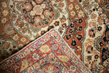 Intricate weave and hand-knotted foundation of an antique Persian rug shown at a folded corner.