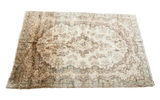 Lustrous Vintage Ivory Kerman Persian rug with a floral medallion, abrash blue, and golden tones.