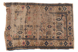 Antique Caucasian rug, heavily worn, geometric pattern in muted ivory, beige, navy, blush.