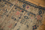 Antique Caucasian rug with significant pile wear revealing its foundation and geometric motifs.