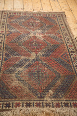 Geometric motifs on hand-knotted Antique Caucasian rug, showing madder red, navy, and ivory wear.