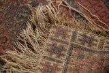 Hard tattered fringe and overcast stitching detail on antique Caucasian rug.