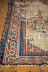 Antique hand knotted Serab runner borders with geometric pawn motifs, time-softened indigo, madder red tones, and pile wear.