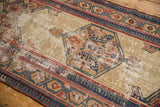 Antique Serab runner's tonal field, colorful medallion, border detail, and visible foundation wear.