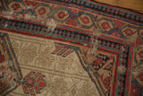 Antique Serab runner's geometric border in red, teal, and black with subtle beige field wear.