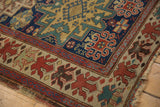 Antique Caucasian rug corner, unusual floral border in cherry red, beige, and oxidized green pile.