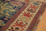 Unusual oversized floral border of an antique Caucasian rug, with wear at the end.