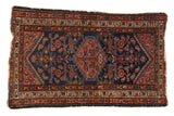 Vintage Borchalou hand knotted rug, indigo blue field, blush diamond medallion, Herati pattern.