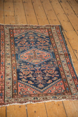 Borchalou rug: diamond medallion, Herati motif in indigo, blush, and exposed side selvage.