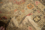 Antique Caucasian rug with even pile wear, faint foundation showing, and fringed edge.