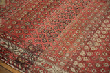 Antique Hamadan rug close-up: nuanced abrash across worn diminutive boteh motifs.