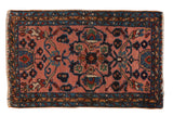 Vintage Lilihan rug with blush field, shadow medallion, floral vinery, and blue borders, 1'10
