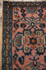 Plush blush field with floral tendrils and triple meandering blue-gold borders.