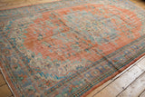 Vintage Distressed Oushak corner, tangerine orange field, pale blue floral border, even wear.