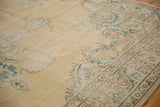 Distressed Oushak carpet detail, highlighting European scrolling vines in mallard green and brown.