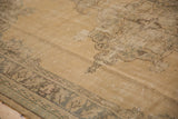 Distressed vintage Oushak carpet texture showing even wear to knot heads.