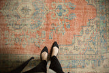Distressed Vintage Oushak carpet with faded cherry red, sky blue, ivory tones and wear.