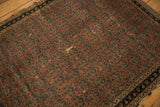 Antique Afshar rug: detailed view of aubergine field, intricate boteh pattern, and areas of threadbare pile.