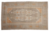 Distressed Vintage Oushak carpet, elongated medallion, turtle borders, ivory and tangerine tones, 5' x 8'2