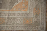 Vintage Distressed Oushak rug corner, pale tangerine turtle main border, ivory vine motifs, low pile.