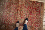 Overhead view of a vintage Farahan Sarouk rug showcasing unusual coloration and fantastic abrashes.