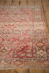 Vintage Farahan Sarouk rug fringe, fuchsia floral palmettes and charcoal border detail.
