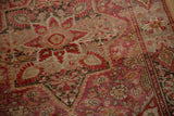 Fuchsia and wine red abrash detailing vintage Farahan Sarouk rug floral palmettes and vinery.