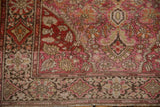Floral vinery, palmettes, and layered borders in fuchsia, wine red, and bronze tones.