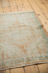 Distressed Oushak rug pile with even wear to foundation, showcasing apricot, ivory, and turquoise.