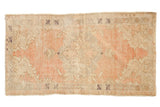 Vintage Distressed Oushak rug, scalloped blush medallion, neutral spandrels, visible foundation wear, 2'7