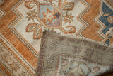 Hand-knotted foundation and distressed bronze pile of a vintage Oushak rug with fringe detail.