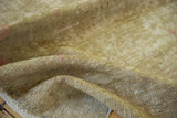 Distressed Oushak rug runner showing worn beige foundation, exposed knot heads, and subtle pink tones.
