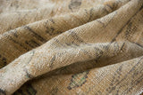 Distressed vintage Oushak carpet texture, even wear to foundation and visible knot heads.