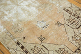 Exposed foundation and knot heads on a distressed vintage Oushak rug.