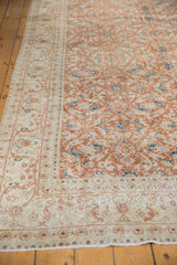 Terra cotta, ivory, aqua Herati-inspired florals on distressed Sivas carpet with even wear.