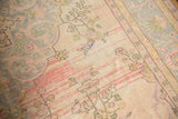 Distressed Oushak carpet with worn pile, visible foundation, and pastel pink, ivory, blue vinery.