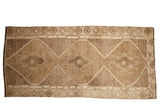 Vintage distressed Oushak runner, triple geometric medallions, step border, muted brown tones, 4x8.