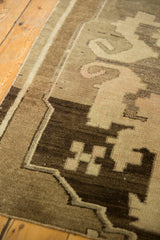 Vintage Oushak runner's low pile, scrolling rectilinear pattern in coffee brown, antique ivory, blush.