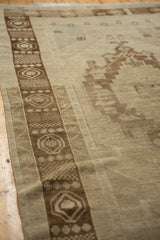 Distressed Oushak rug germinating seed main border, dark chocolate bronze and ivory tones.