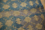 Distressed Sparta rug detail: bold floral blossom, aqua blue, grey abrash.