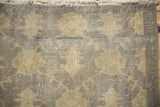 Distressed Sparta runner's worn pile texture, visible foundation, silver, and aqua blue.