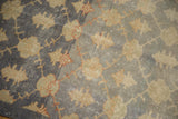 Distressed vintage Sparta rug showing bold floral motif, aqua blue abrashes, and wear.